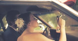 Couple wedding inside car rearview mirror Wallpaper