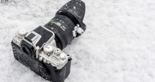 The camera lies in the snow Wallpaper